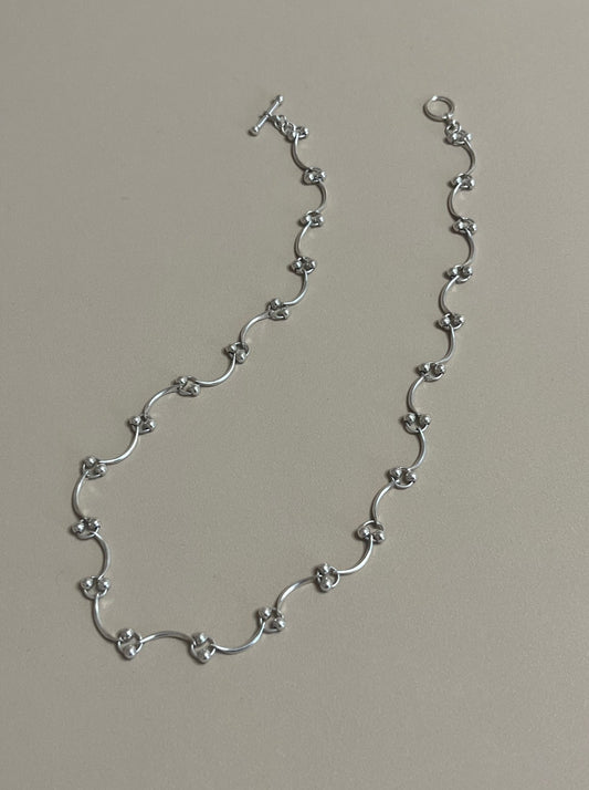 CURVED LINK CHAIN WITH MINI SPHERES